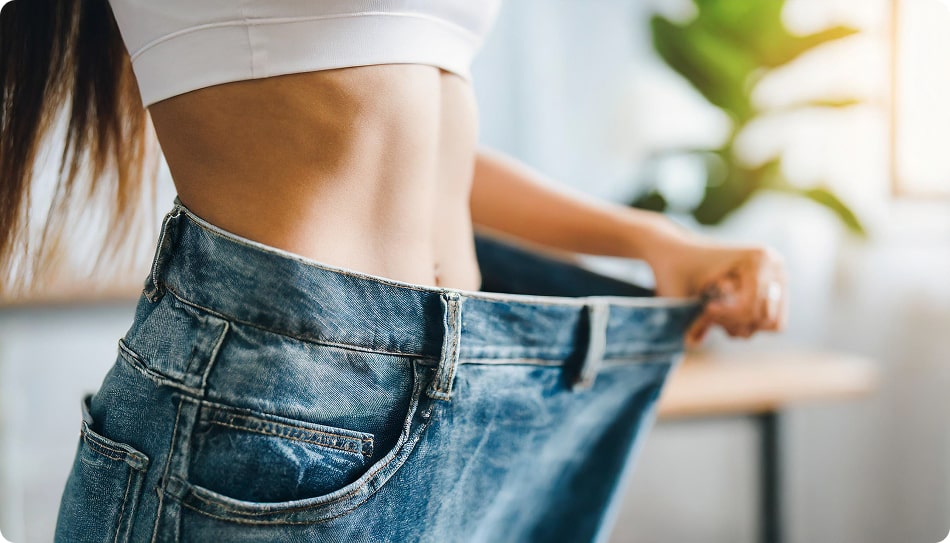 slim-woman-celebrates-weight-loss